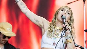 Miley cyrus arm tattoo meaning. Miley Cyrus Left Italy With A Snake Tattoo Photos Allure