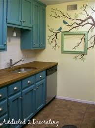 Turn Raised Panel Cabinet Doors Into Recessed Panel Doors Addicted 2 Decorating Raised Panel Cabinet Doors Cabinet Door Makeover Painted Floor Cloths