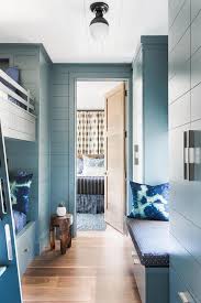 Shiplap wall, farmhouse bedroom, shabby chic bedroom, white bedding. Blue Shiplap Walls With Blue Bunk Beds Transitional Boy S Room