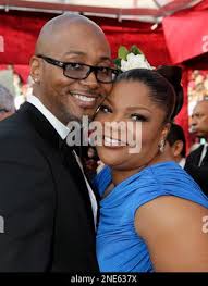 Mo'Nique, right, and her husband Sidney Hicks arrive at the 82nd Academy  Awards Sunday, March 7, 2010, in the Hollywood section of Los Angeles. (AP  Photo/Amy Sancetta Stock Photo