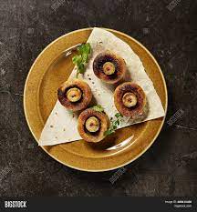 Whether it's an extra splash of cream, a homemade glaze, or a sprinkle of fresh herbs, special ingredients make these fancy feasts stand above the rest. Grilled Mushrooms Top Image Photo Free Trial Bigstock