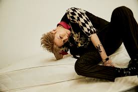 He debuted at age 14 as a member of the group shinee in may 2008. Sm Entertainment