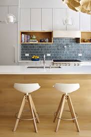 This kitchen island features a simple modern design and can be fit into various styles of decorations. Geometric Tiles Modern Kitchen Backsplash Kitchen Backsplash Designs Modern Kitchen