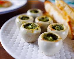 If you have the snails in shells, ready to go, simply preheat the oven to broil, place the snails in a baking dish, and broil until the butter is sizzling. Escargot A L Alsacienne Sizzling Hot Snails Out Of Shell With A Garlic Herb Butter Broth Bread Picture Of Haig Rd Bistro Brisbane Tripadvisor