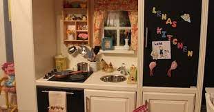 Tara's young son loves helping out in the kitchen, playing chef, and helping her bake cookies. Diy Play Kitchen From An Entertainment Center Play Kitchen Diy Play Kitchen Kids Play Kitchen