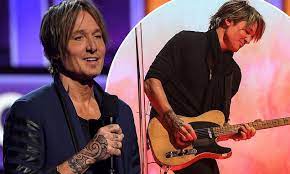 (ap photo/mark humphrey) urban also has a tribal bird tattoo on his left forearm, a sun on his chest, more tribal. Keith Urban Shows Off New Tribal Ink Design On His Hand At The 56th Academy Of Country Music Awards Daily Mail Online