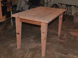 I then clamped the plywood to my work table with the first edge i wanted to trim hanging over the side, and used the the veneer was a little wider than the edge of the tabletop, so i was sure to line it up flush along the top with the excess along the bottom where i planned to trim it down when i was done. Make A Wooden Table That Is Easily Disassembled Make