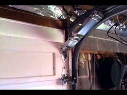 It can be used on any sectional garage door that has clearance the top guides (which hold the uppermost garage door rollers) are replaced with these specially designed brackets that cause the top of the. Damaged Garage Door Low Ceiling Youtube