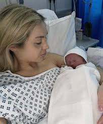 Pregnant Jess Wright cuddles her baby nephew after he's born a month early 