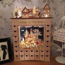 This Advent Calendar Is An Attractive Feature In The Pre Christmas Period The Lamp And Houses Wooden Advent Calendar Wood Advent Calendar Diy Advent Calendar