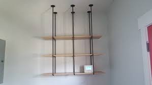 Using adhesive hooks the adhesive hooks are an outstanding solution. What Are The Alternative Options To Hang Shelves On A Concrete Wall Without Drilling Holes Quora
