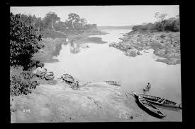 Chengannur River 1900s - An old photo of a man in a boat… — PICRYL - Public Domain Media Search Engine