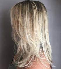 Medium blonde hairstyle with flicked ends. 50 Best Medium Length Layered Haircuts In 2021 Hair Adviser