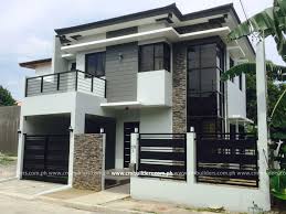This iron and wood gate is just for it. Modern Zen 2 Storey Residence Vermont Royale Antipolo City 01 2 Storey House Design Philippines House Design House Gate Design