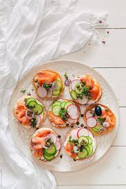People all around the world enjoy the versatility of this smoked fish. Smoked Salmon Breakfast Toasted Bun Stocksy United Smoked Salmon Breakfast Salmon Breakfast Food Photography Lighting