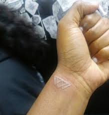 White Tattoo On African American Skin Whitetattoo Blackskin Triangles White Tattoo Tattoos Tiny Tattoos