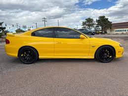 Image result for Yellow 2004 Pontiac