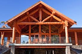 Wood beams inside a building. Alpine Log Timber Homes Specialists In Timber Log Homes