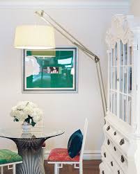 While there are many colors going on here including brown, white, black and touches of red and green (in the area rug), they come together to create a very interesting interior design space. Glass Topped Table Photos 3 Of 3