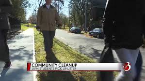 College students cleaning up in their community