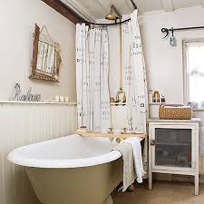 The pristine white tub, sink, and medicine cabinet really pop against the ridged ceiling, stone walls, and wood floors. Cottage Bathroom Ideas Uk Novocom Top
