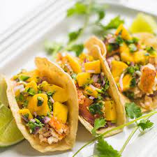 All wrapped up in corn tortillas, this san diego, california favorite is sure to be a hit in your home! Fish Tacos With Mango Salsa Recipe Yummly Recipe Mango Salsa Recipes Recipes Mango Salsa