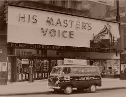 The original HMV record shop on Oxford Street, London. Also on show is an  original wooden advertising sign for HMV Records