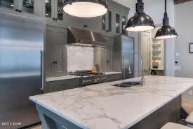 It feels spacious and bright without needing to follow an all white color palette. Home Improvement Archives Kitchen Backsplash Designs Grey Kitchen Cabinets Dark Countertops