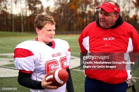 Timothy Mashburn holds the game ball given to him by his coach, Mike...  News Photo