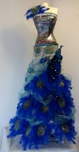 Maybe you would like to learn more about one of these? Mannequin Christmas Tree With A Peacock Theme Seams And Scissors