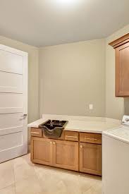 this laundry room features a salon sink