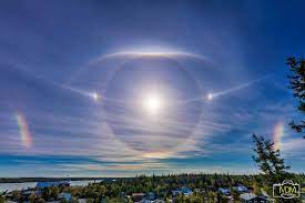 A sun halo is caused by the refraction, reflection, and dispersion of light. A Sun Halo Sundogs And More Today S Image Earthsky