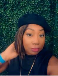 Militant style outfit with black dress and beret