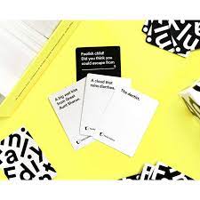 Each round, one player asks a question from a black card, and everyone else answers with their funniest white card. Cards Against Humanity Family Edition Greenfield Games