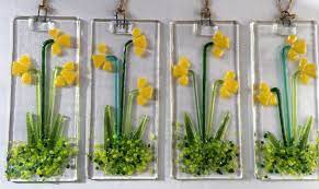 This fused glass suncatcher has three flowers in translucent orange, yellow and light purple. Fused Glass Daffodils Spring Flowers Garden Sun Light Catcher Wall Art Hanging Teachers Gift Decoration Spring Garden Flowers Glass Flowers Fused Glass