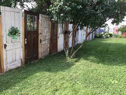 Empty single isolated cartoon garage with doorway. Yard Fence Made Out Of Old Doors Decor Home Ideas