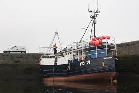 Sea kayaking with seakayakphoto.com: I saw just a flicker of respect cross  their weather beaten faces.