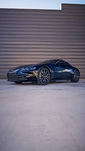 Image result for Titanium Silver 2011 Aston Martin
