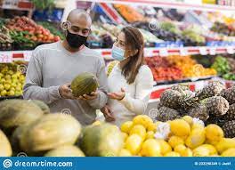 Husband and Wife Wearing Protective Masks Picking Ripe Melon at a  Supermarket Stock Image - Image of variety, lifestyle: 233290349