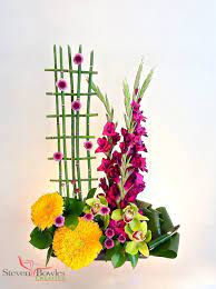 Modern Floral Arrangements Of Gladiola S Sun Flowers And Orchids Designed By Steven Floral Art Arrangements Modern Floral Arrangements Modern Floral Design