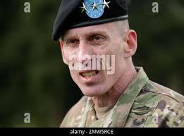 Lt. Gen. Gary Volesky, the I Corps commanding general, poses for a photo  with two Soldiers from Task Force Regulars, at Ban Dan Lan Hoi, Thailand,  Feb. 12, 2019. This was part