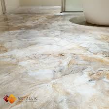 The classic elegance of marble flooring. A Rustic Stone Marble Flooring Looks Beautiful Against The Light Pale Colour Theme Of This Guest Concrete Stained Floors Rustic Stone Painted Concrete Floors