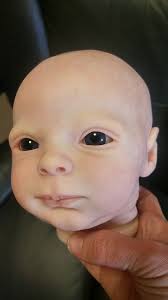 Removing paint from a baby bird safely