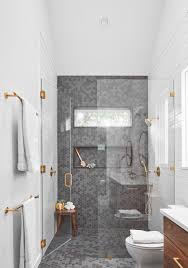 The most common white and gold tile material is porcelain & ceramic. Gold Hardware Is The Accent In This Bathroom S Palette That Also Includes White And Grey Tiles And Wood Drawers