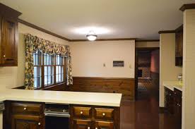 😉 so if you're considering this product and you missed it, go read the since the planet is moving from grey to black, here is the scoop on when it's a good idea and when it's a bad idea to paint your doors black. Painting Dark Trim Paneling In The Kitchen Young House Love