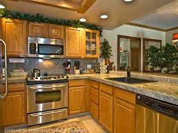 I Like The Oak Cabinets With The Light Colored Countertops Honey Oak Cabinets Oak Kitchen Cabinets Oak Cabinets