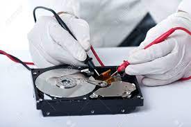 A Technician Repairing An Hard Disk With A Tester Stock Photo, Picture And  Royalty Free Image. Image 20400760.