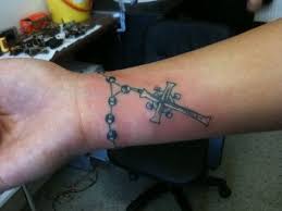 Grey rosary chainband tattoo on wrist. 31 Small Rosary Tattoos For Women Ideas Tattoos For Women Tattoos Rosary Tattoo