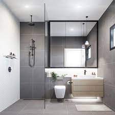 These gorgeous modern bathroom ideas are sure to make you want to go contemporary with your so why not revive your bathroom with this modern bathroom design? Contemporary Refreshing Grey Bathroom With Elements Of Timber Greenery Monochro Bathroom Layout Small Bathroom Remodel Scandinavian Bathroom Design Ideas