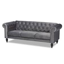 Tori spelling orange tufted chesterfield sofa, moroccan tray coffee table, black fireplace, mirror and drapes. Emma Velvet Upholstered Button Tufted Chesterfield Sofa Baxton Studio Target